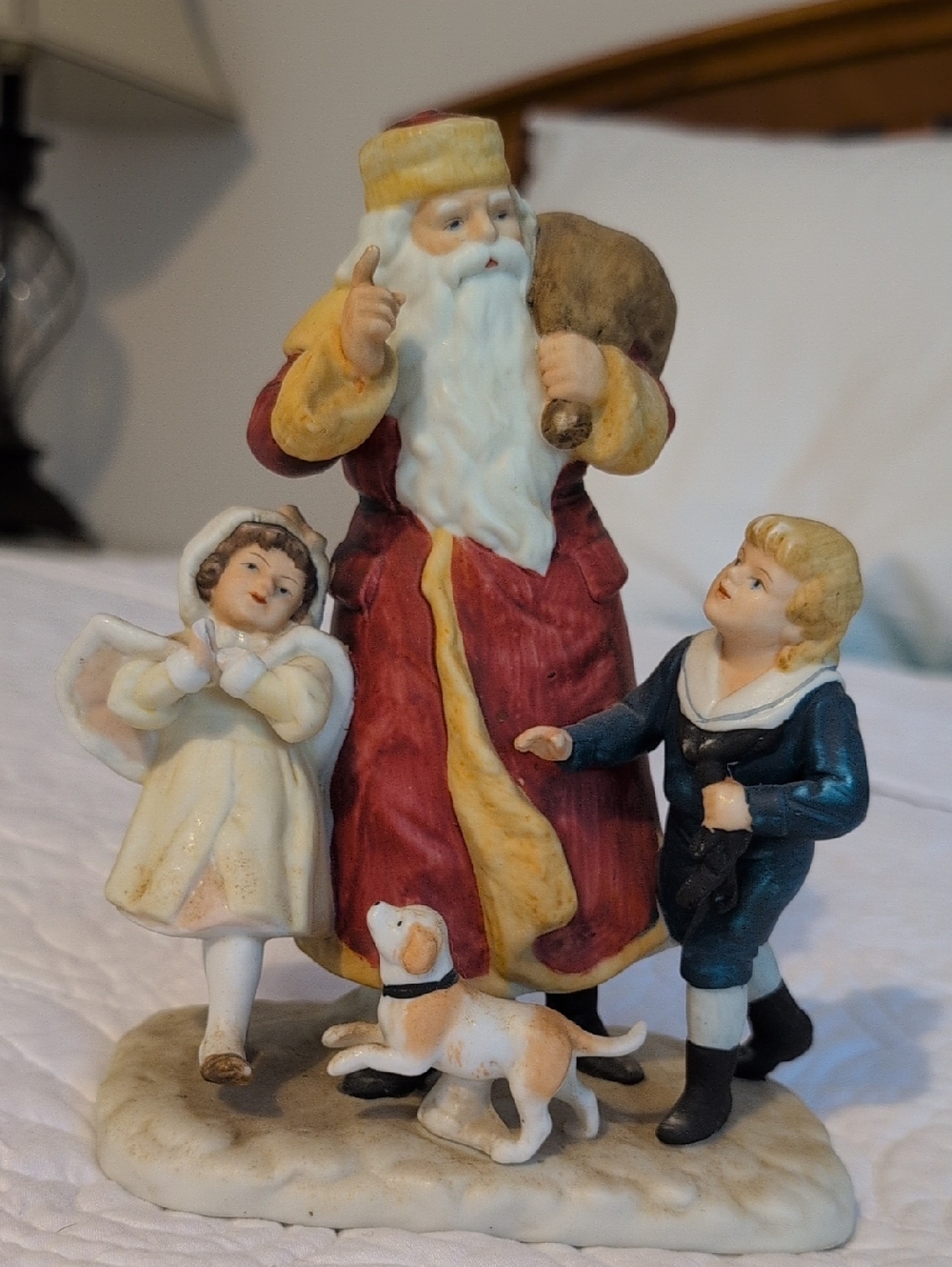 Festive Santa with Children Ceramic Figurine - Red and Cream